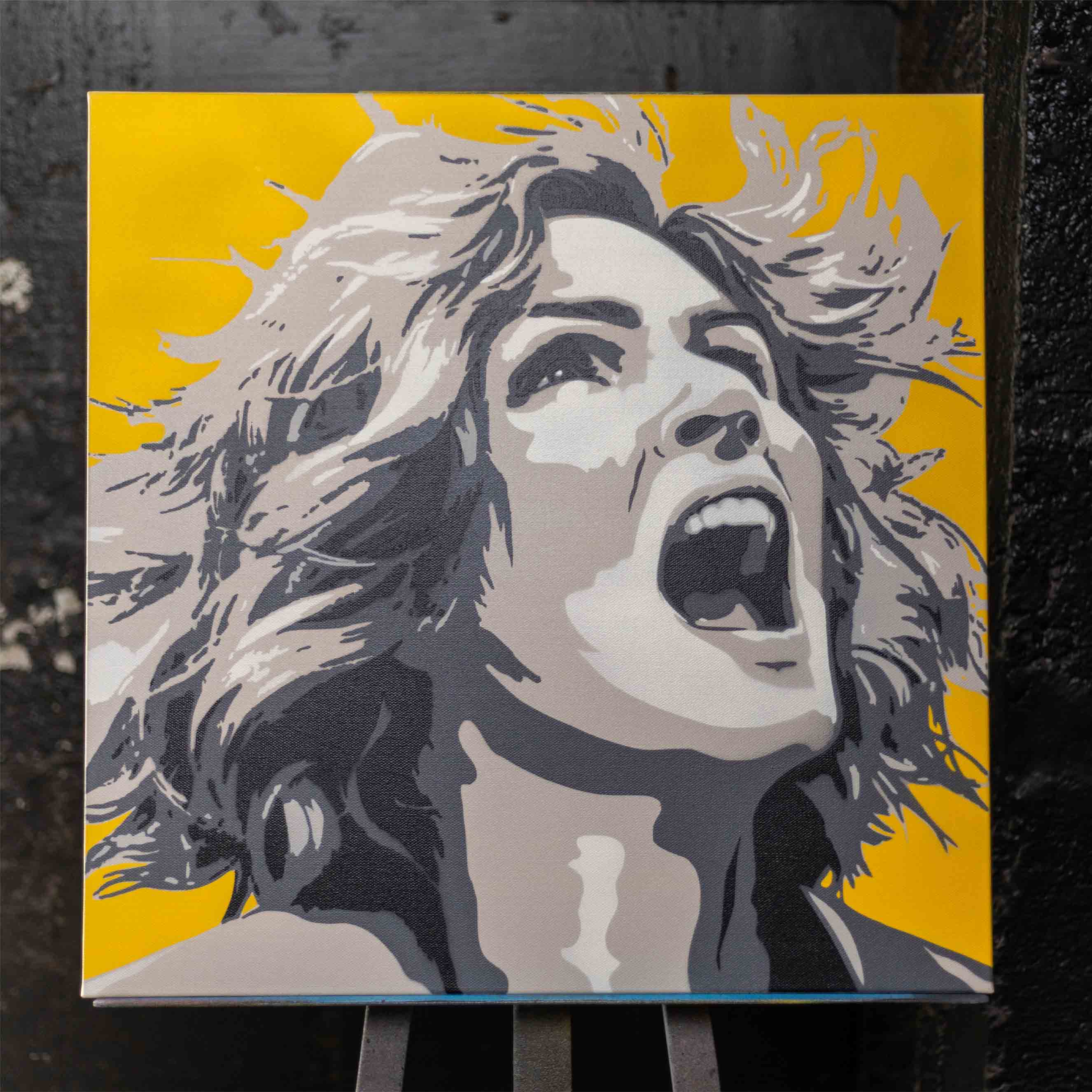 carol from pluribus spray painting with yellow background