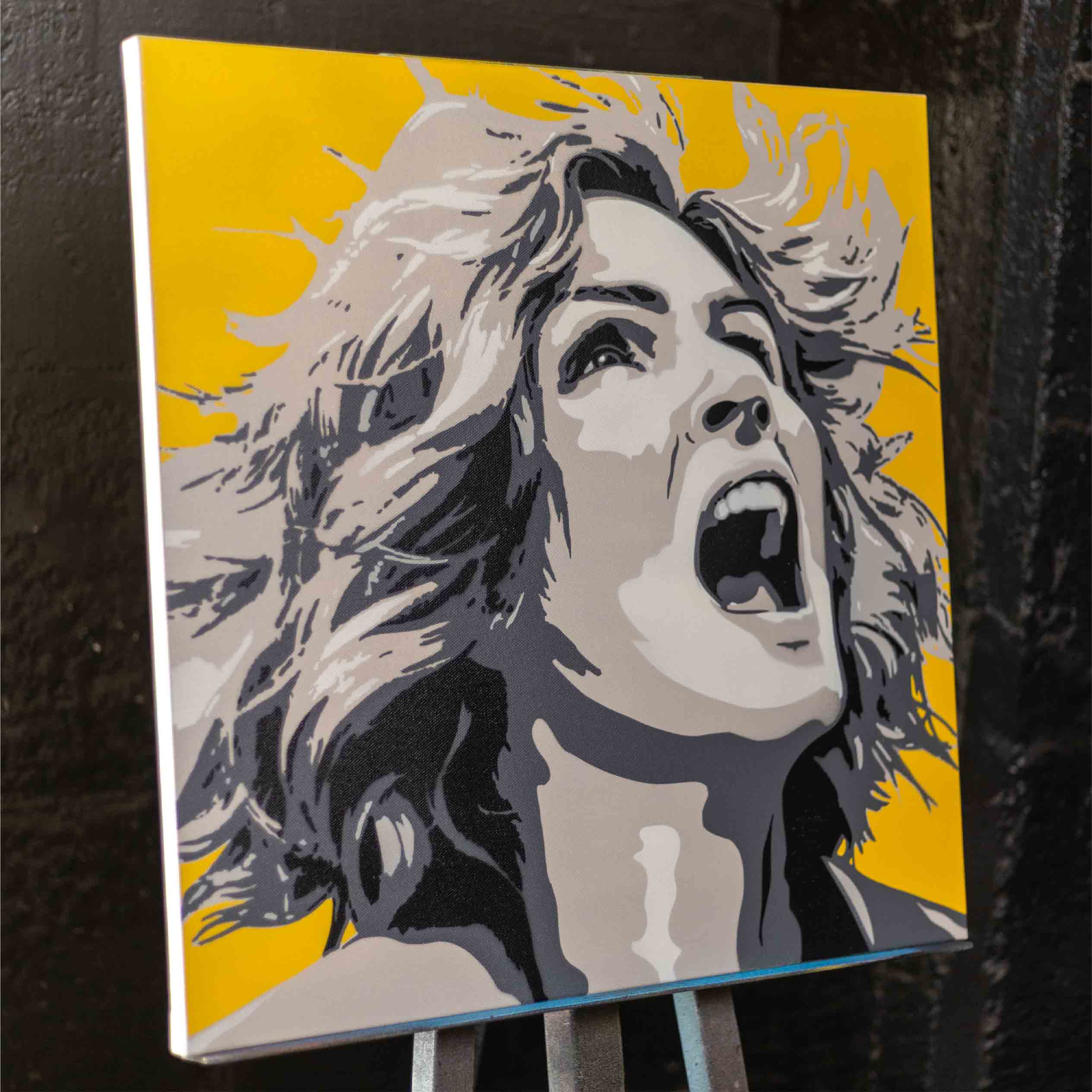 carol from pluribus spray painting with yellow background