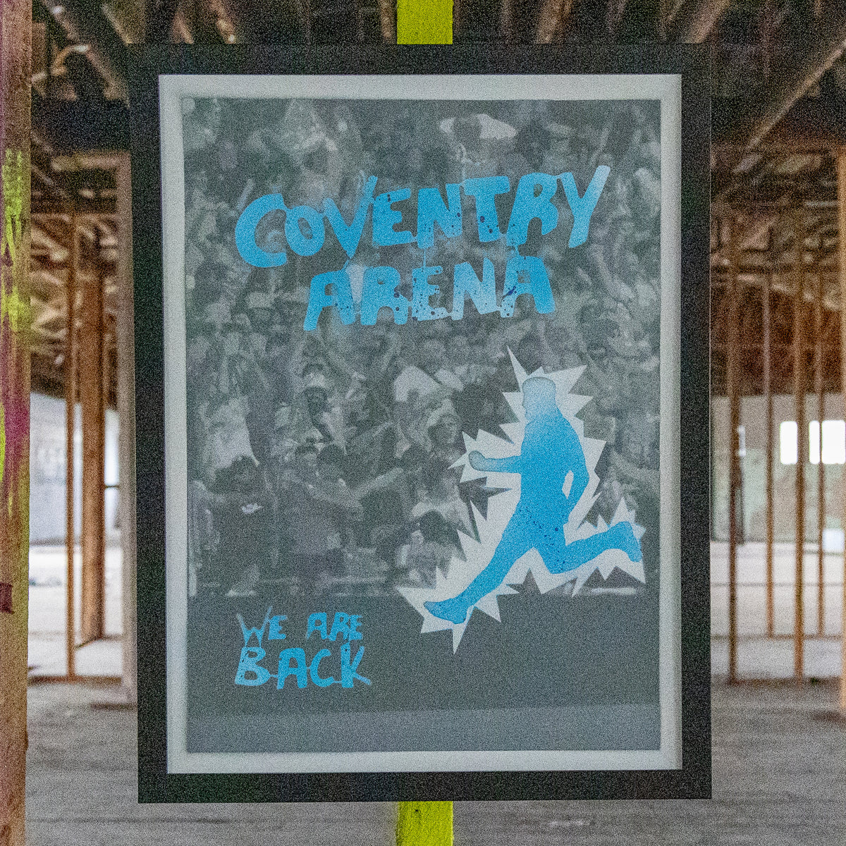Coventry Arena hand-sprayed stencil art in bright cyan over a cool grey crowd, framed in black, one-of-one Layered Original by Made By Cito