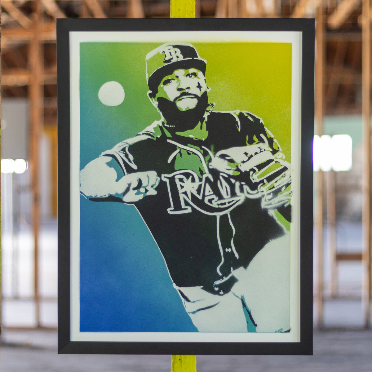 Junior Caminero Tampa Bay Rays hand-sprayed stencil art, black jersey over a teal-to-chartreuse fade, framed in black, one-of-one Layered Original by Made By Cito