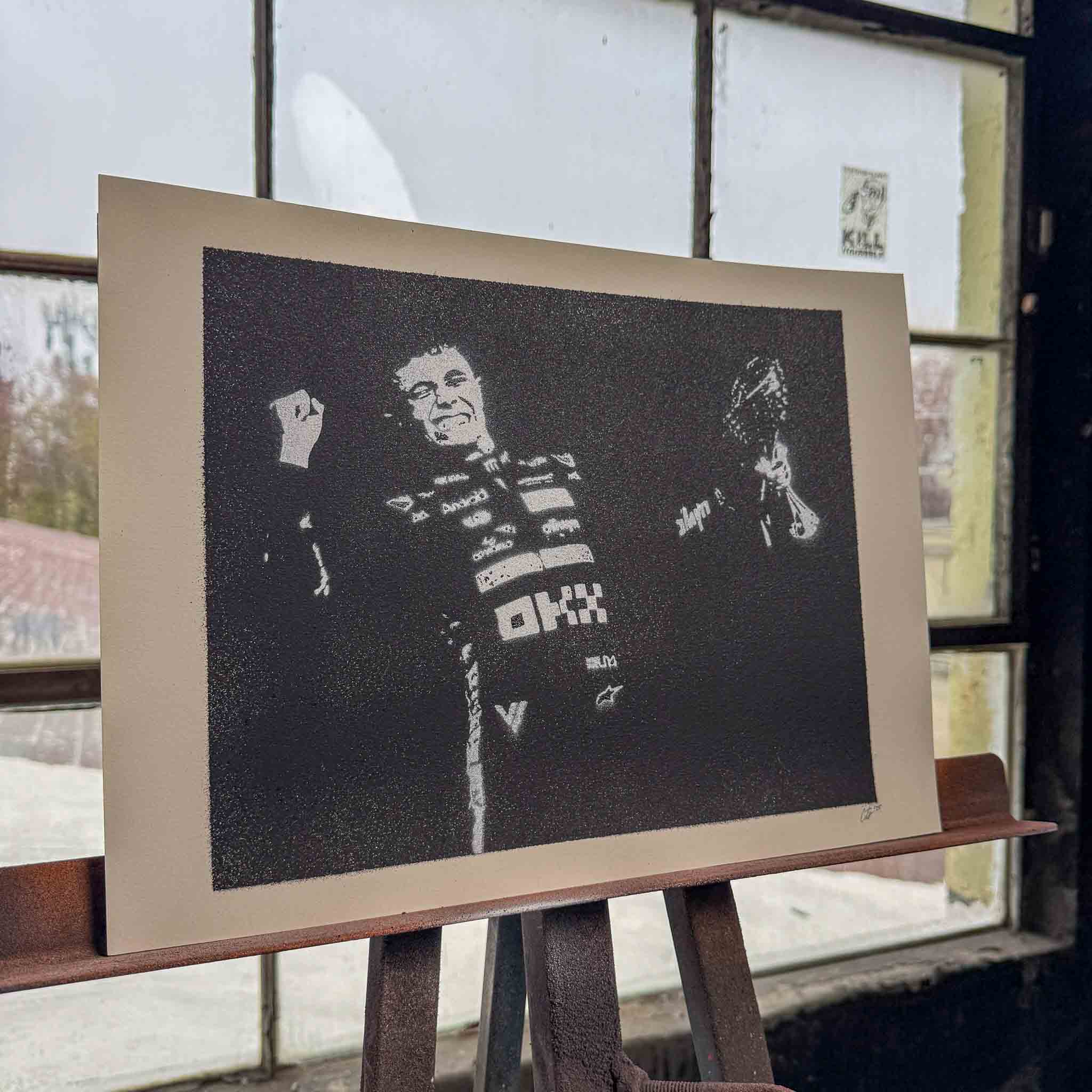 lando norris spray painting on easel