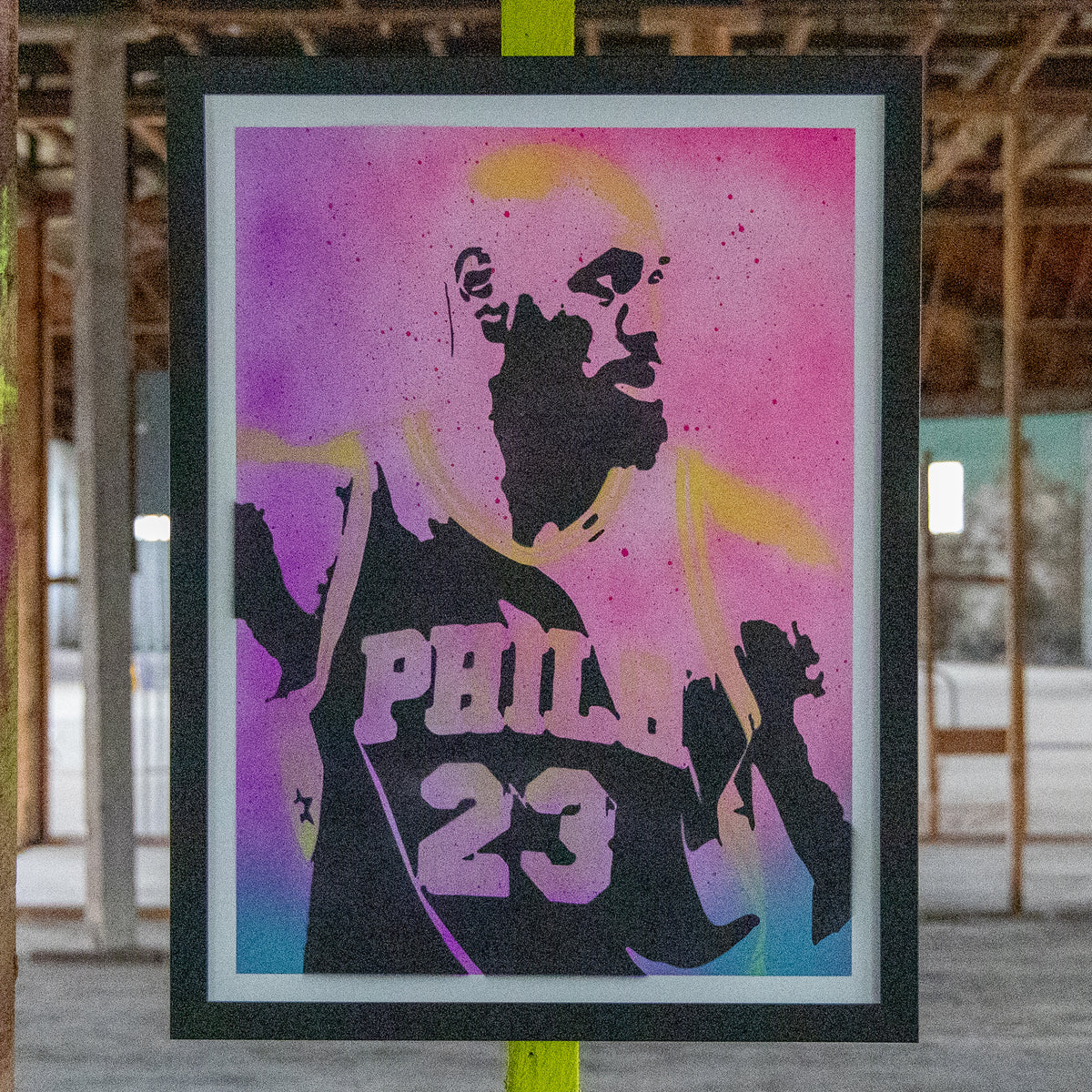 LeBron James in a Philadelphia #23 jersey, hand-sprayed stencil art with a pink-to-sky-blue fade and neon yellow highlights, framed in black, one-of-one Layered Original by Made By Cito
