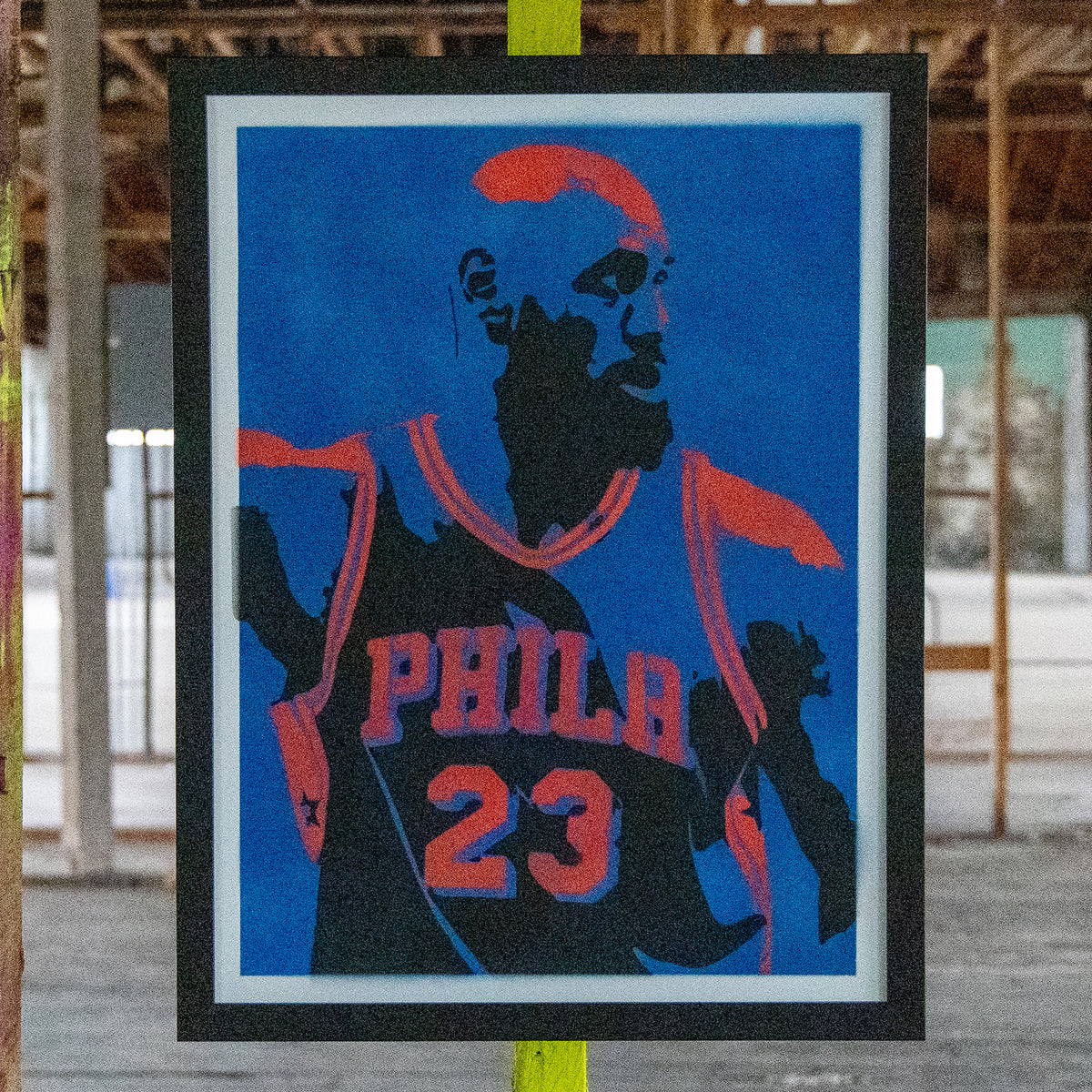 LeBron James in a Philadelphia #23 jersey, hand-sprayed stencil art with a royal blue background and coral-orange highlights, framed in black, one-of-one Layered Original by Made By Cito