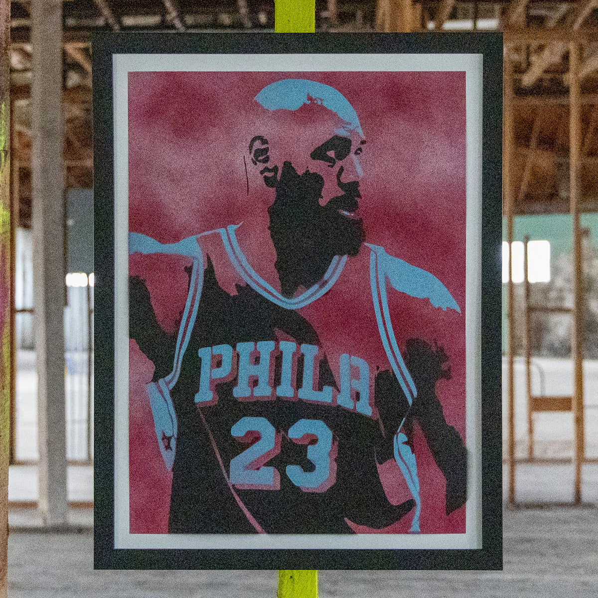 LeBron James in a Philadelphia #23 jersey, hand-sprayed stencil art with a deep crimson background and powder-blue highlights, framed in black, one-of-one Layered Original by Made By Cito